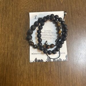 Set of adjustable bracelets with tiger eyes and lava rock designs.